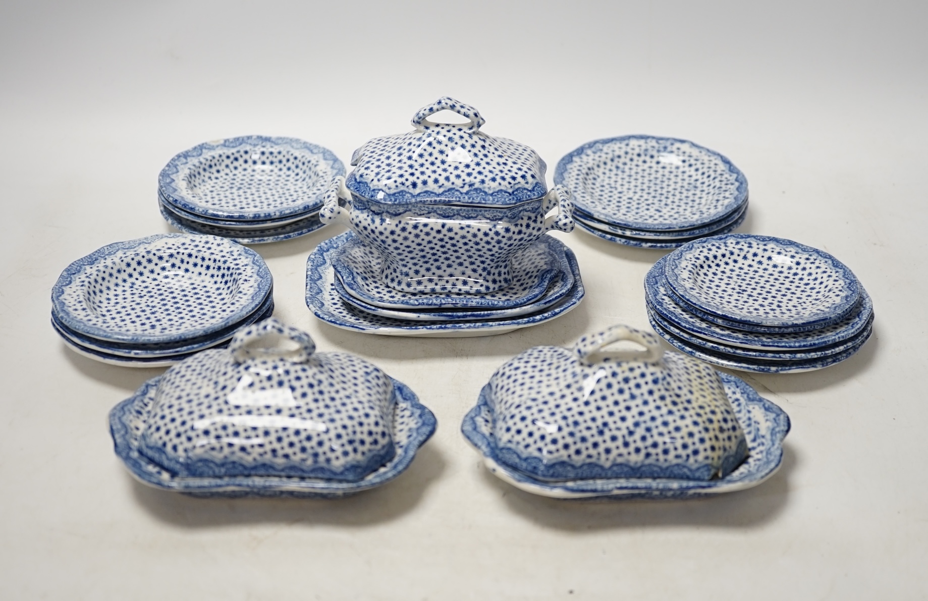 A 19th century blue and white child's twenty piece dinner service, tallest tureen 9cm high. Condition - cover on smaller tureen and soup dish cracked, manufacturing faults on the transfer printed decoration